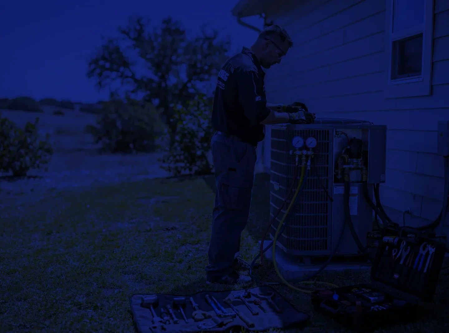 Plumbing and HVAC technicians working on home service equipment